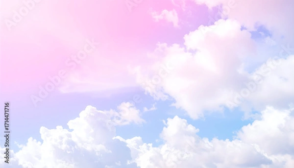 Fototapeta Soft pastel colored sky with fluffy white clouds in a gentle gradient