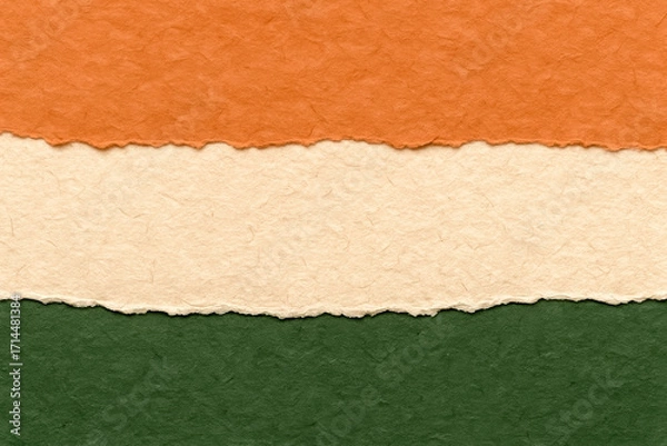 Fototapeta Torn paper layers in orange, cream, and green – textured abstract background
