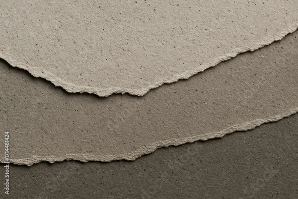 Fototapeta Layered torn recycled paper texture in neutral greys