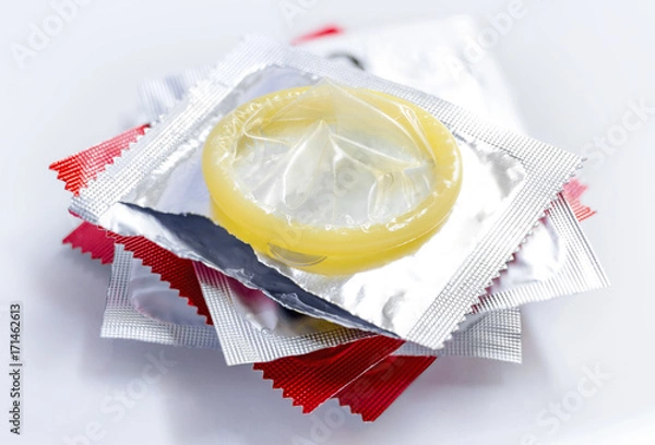 Obraz stack condoms isolated on white background.