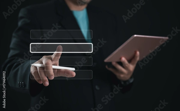 Fototapeta Business professional selecting digital menu option with stylus on virtual interface while holding tablet. Concept of UI design, technology, data input, and modern interactive user experience.