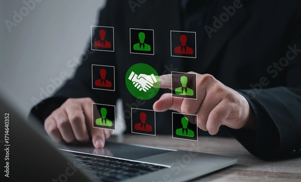 Fototapeta Office professional selecting candidate profile with handshake icon on digital interface. Concept of collaboration, teamwork, recruitment, partnership, and human resources cooperation.