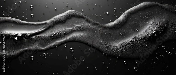 Fototapeta Wavy line of suds with bubbles on black background, creating a textured, abstract pattern