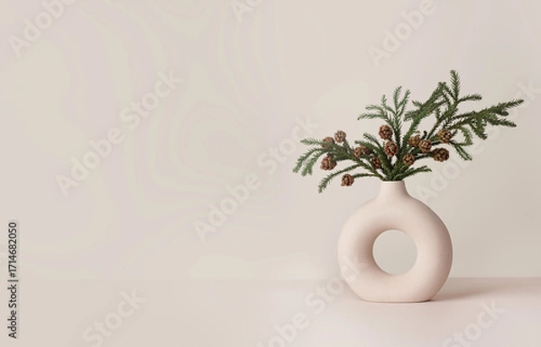 Fototapeta Coniferous branch with cones. White minimalist ceramic vase in Scandinavian style.