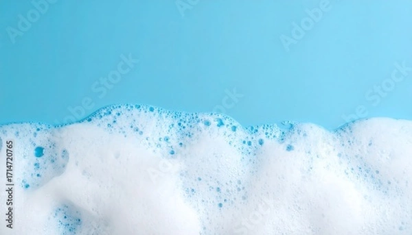 Fototapeta Detergent foam bubble on blue background, soap, shower gel, shampoo foam texture, copy space