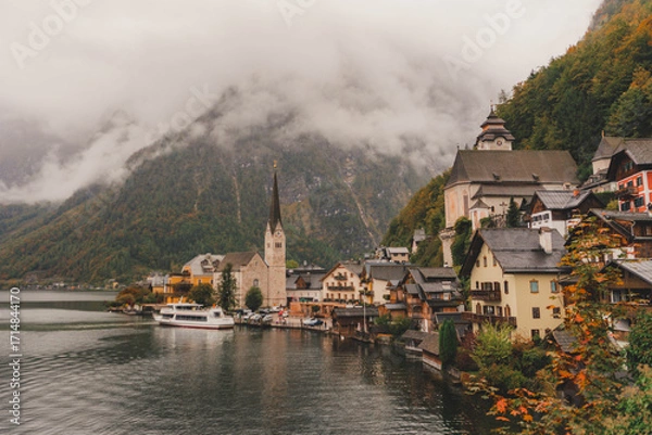 Obraz View of the church, lake and mountains from Hallstatt's most famous viewpoint on a cloudy day of autumn
