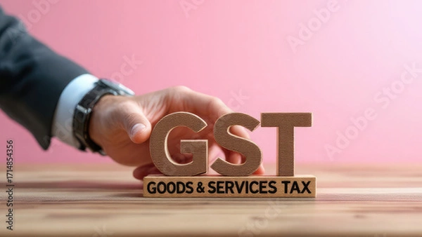 Fototapeta Businessman's hand arranging wooden blocks symbolizing the implementation of a national unified indirect tax system