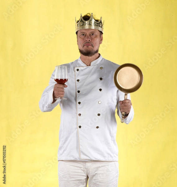Fototapeta chef with a crown in a white suit on a yellow background
