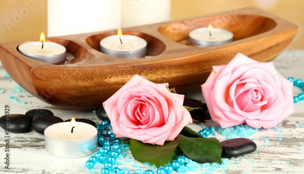 Fototapeta Relaxing Candle Display with Pink Roses and Wooden Tray Arrangement