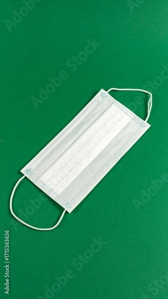 Obraz White mask on green background