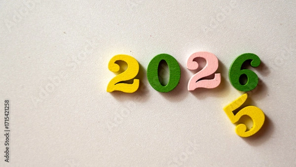 Fototapeta Colorful Wooden Numbers 2025 and 2026 on Light Background