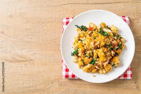 Obraz stir-fried egg with Thai basil and chilli