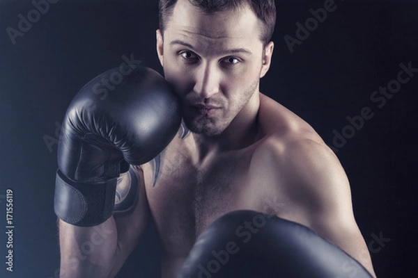 Fototapeta  Man in boxing gloves