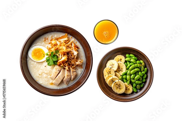 Fototapeta Healthy breakfast menu with porridge banana edamame and orange juice isolated on white background
