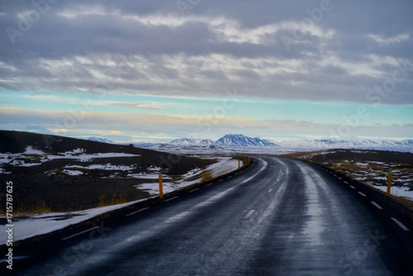 Fototapeta Road number 1 for travel in Iceland after rainy day and mountain view.
