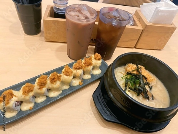 Obraz Japanese Food Set with Sushi Roll, Ramen, and Iced Drinks on Table
