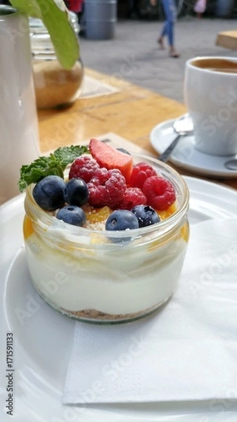 Obraz Fresh berries and cream mousse.Dessert in a jar
