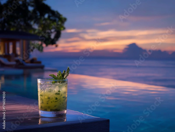Obraz Refreshing cocktail in serene sunset by the pool.