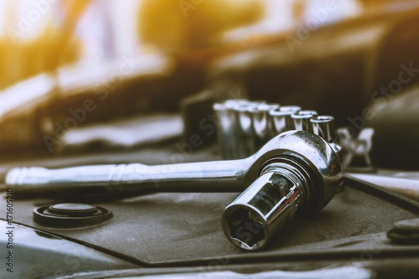 Fototapeta wrench ratchet placed in front of the engine Prepare for engine maintenance.
