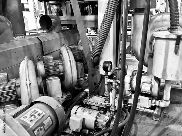 Fototapeta Industrial air blower system with electric motors in a factory. The blowers are used for ventilation, dust collection, or material transport in manufacturing processes. The image highlights the mechan