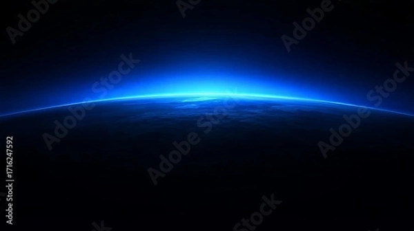 Fototapeta Earth's horizon illuminated by a bright blue atmospheric glow against the darkness of space