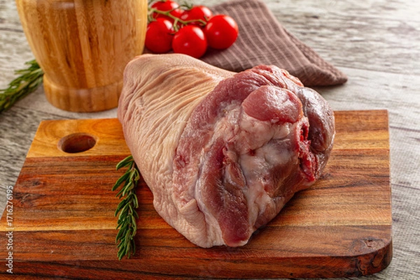 Fototapeta Raw pork knuckle over board
