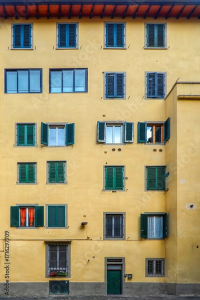 Obraz Facade of a traditional Italian residential building with multiple windows and shutters