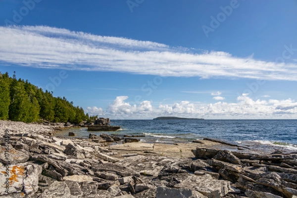 Obraz A stunning view of Flowerpot Island's rugged coastline in Georgian Bay, Ontario, showcasing its unique limestone formations and serene natural beauty.