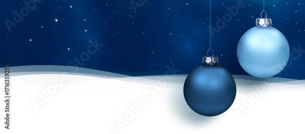 Obraz Blaue Weihanchtskugeln vor winterlichem Hintergrund