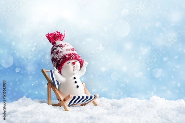 Fototapeta One little snowmen on deck chair in caps on snow in the winter. Background with a funny snowman. Christmas card.
