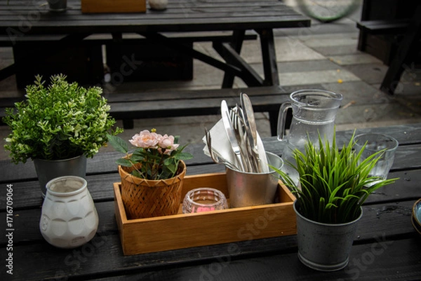 Obraz Table in a restaurant with cutlery and decorations
