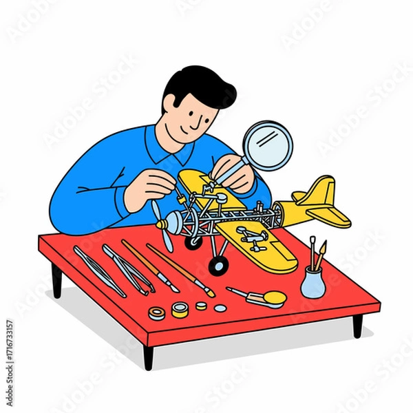 Fototapeta Man meticulously assembles a model airplane, showcasing precision and detail in his hobby
