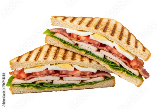 Obraz Two halves of a gourmet club sandwich with grilled bacon, chicken, lettuce, tomato, egg layers on a transparent studio background, macro shot, appetizing food photography concept