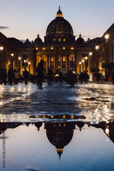 Obraz Panoramic night view of St Peter's Basilica with beautiful reflection in Vatican City. Architecture, landmark and attractions of Rome, Italy. Vertical photo