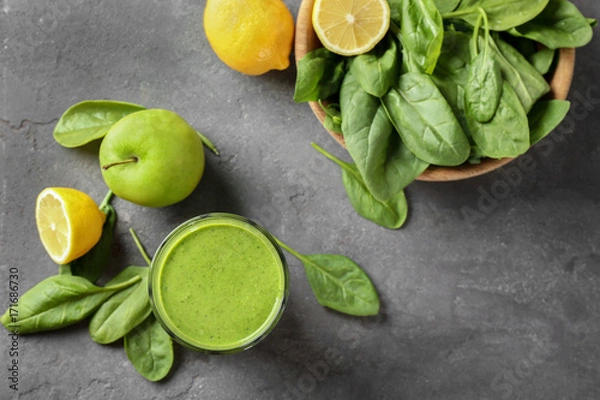 Fototapeta Composition with spinach smoothie on table