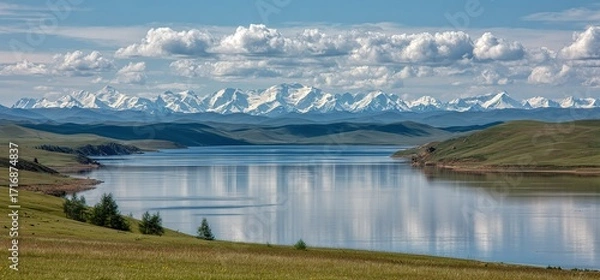 Fototapeta Expansive Landscape with Mountain Lake Reflection, Serene Nature Background, Snowy Peaks and Meadow