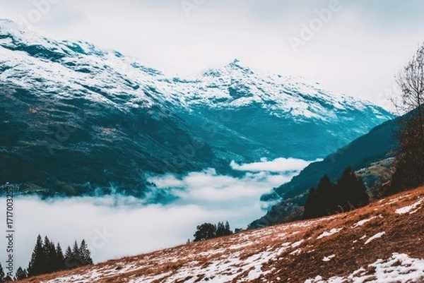 Obraz Snow-capped mountains, valley shrouded in mist
