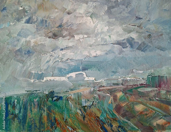 Fototapeta clouds over a field