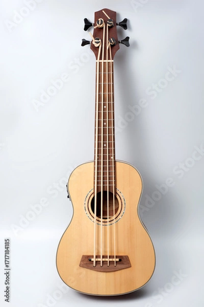 Fototapeta Four-string bass ukulele with wooden body and built-in tuner and pickup.