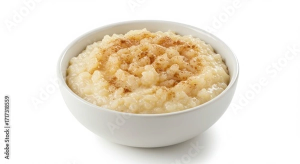 Fototapeta Bowl of arroz con dulce Puerto Rican spiced rice pudding isolated on a white background for food or dessert uses