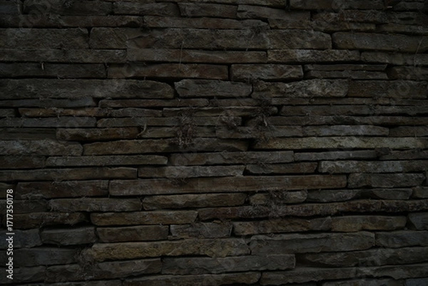 Fototapeta Stone wall texture old masonry background dark stone bricks close up texture Rustic stone wall natural background