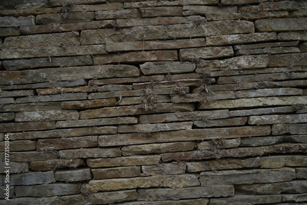 Fototapeta Stone wall texture old masonry background dark stone bricks close up texture Rustic stone wall natural background