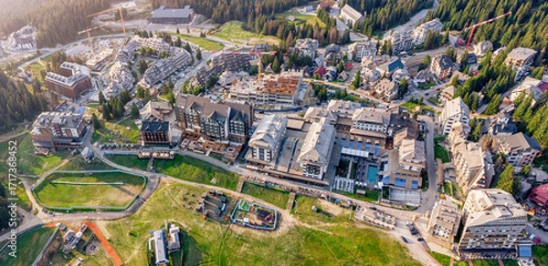 Fototapeta Kopaonik mountain resort showing hotels, apartments, and new construction, highlighting ongoing development in the Serbian tourist destination