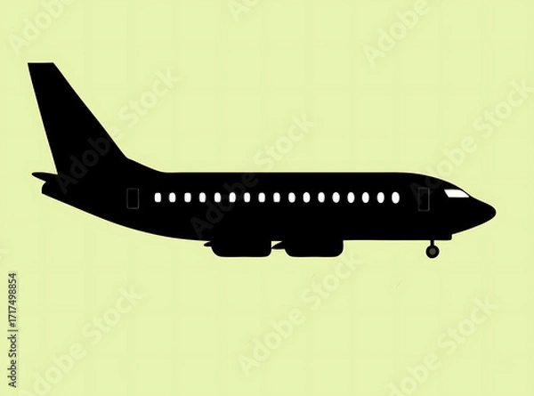 Fototapeta An unique black silhouette of a commercial airplane side view left to right on texas color background. Clean and minimal, centered graphic or logo icon of flight.