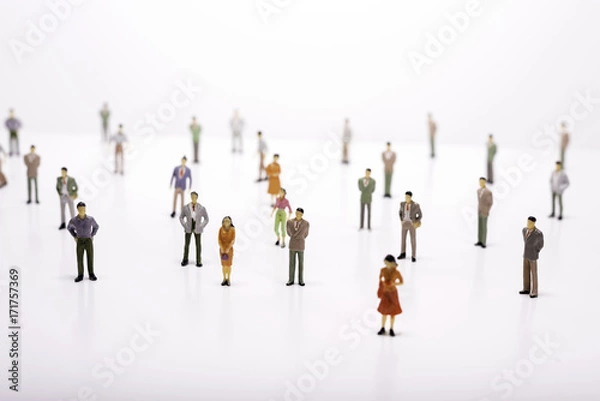 Fototapeta Group of miniature people over white background.