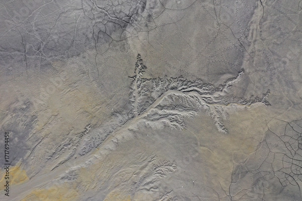 Fototapeta Abstract mud cracks and patterns aerial view