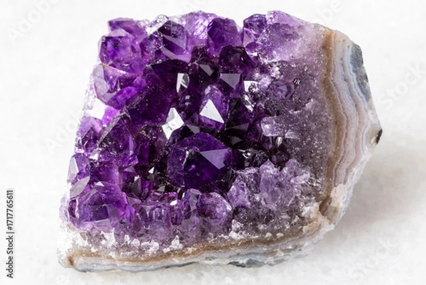 Obraz raw geode of amethyst mineral crystals on white