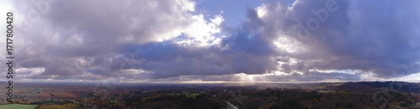 Fototapeta Aerial Panoramic of  Forest with sunrays orange colors in autumn