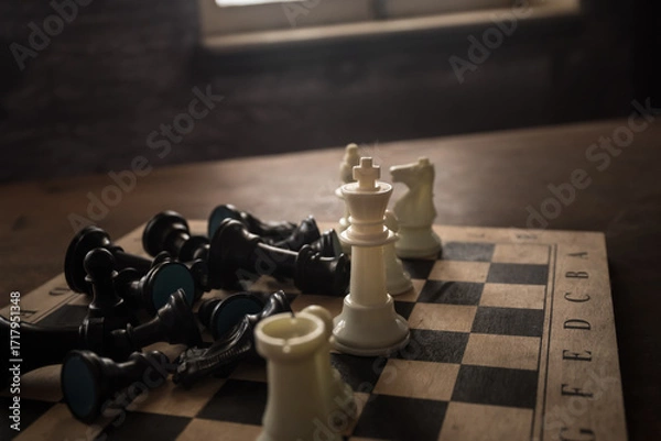 Fototapeta Chess board game concept of business ideas and competition and strategy ideas concep. Chess figures on a dark background with smoke and fog. Selective focus