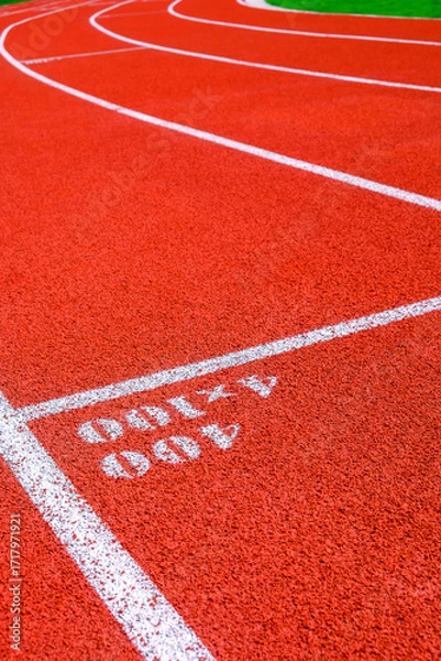 Fototapeta Running track in the stadium, sport background and texture. Running track for athletics